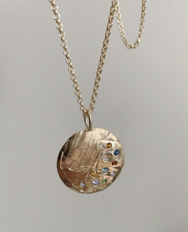 Custom sapphire and gold pendant